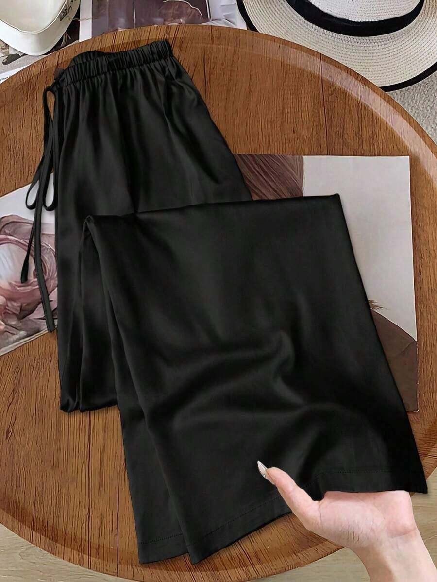 Pantalones anchos de pierna ancha de satén negro de larga duración con ajuste cómodo para mujeres, pantalones de satén negro, pantalones de seda para mujeres, pantalones de satén negro, pantalones de seda negra, pantalones casuales para mujeres - Negro - Ver 1