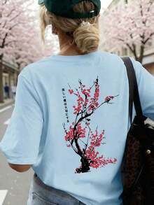 Camiseta holgada de estilo japonés con estampado de flores de cerezo para mujer, 100% algodón, transpirable, de cuello redondo y manga corta, ropa de calle Y2K, adecuada para salidas de primavera, paseos urbanos y uso diario casual, color rosa de verano. - Celeste - Ver 5