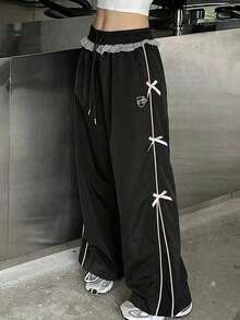 Pantalones casuales de mujer con estampado, cintura con cordón y bolsillos - Negro 4 - Ver 1