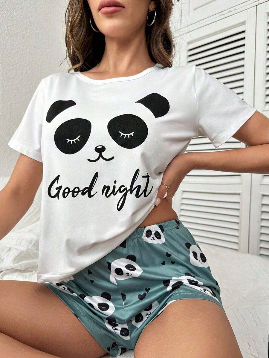 Una camiseta de manga corta para mujer con estilo retro americano, de corte holgado y con diseño estampado (los pantalones son solo para sugerencias de estilo). Esta pieza sencilla y elegante presenta un patrón de letras impresas con temática tropical, lo que la convierte en un elemento imprescindible para crear un look relajado de vacaciones, perfecto para ocasiones como el Día del Trabajo y el Día de la Independencia de México. - Blanco - Ver 1