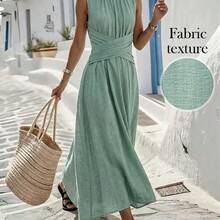 guang zhou mi qian shang mao  Vestido casual sin mangas de color verde oliva para mujer con diseño de cintura cruzada, estilo minimalista que muestra elegancia, adecuado para uso diario, té de la tarde, reuniones casuales y viajes de negocios ligeros - Caqui - Ver 2