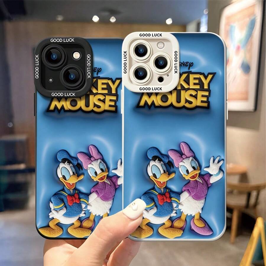 Officially Licensed Disney Donald Duck & Daisy Duck Phone Case, This Protective Phone Case Features Plush‑Style Donald Duck And Daisy Duck Waving Cheerfully, Topped With Raised Bold "MICKEY MOUSE" Lettering, Set Against Bright Blue Bubble‑Textured Background, Made With Flexible, Durable TPU Material To Protect Against Everyday Scratches, Bumps, And Minor Impacts, Compatible With IPhone 17, 16, 15, 14, 13, 12, 11 Pro Series And Galaxy S22, S23, S24, S25 Models, Ideal For Disney Fans. - màu đen - Xem 1