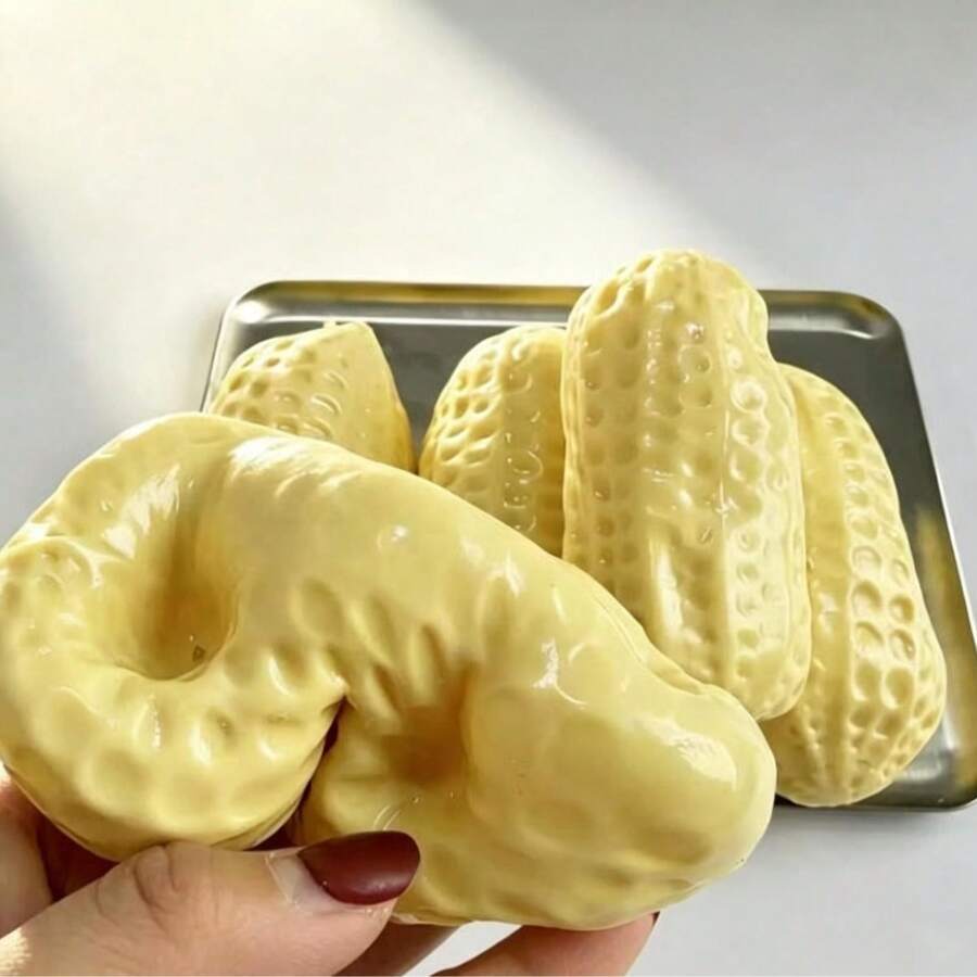 1个可塑形椰子油软花生捏捏球，手工制作，无回弹手指玩具 - 彩色 - 查看 1
