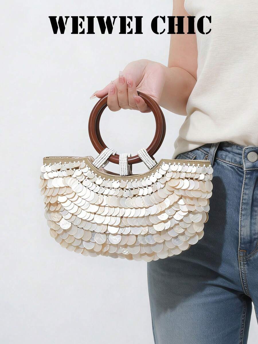 Lässiger Urlaubsstil beige Muschelmuster Quasten Shopper, mit Holzring Griff und handgefertigtem Muschelperlen Design. Ideal für Mädchen, die Urlaubsstil lieben. Geeignet für Strandurlaub, Ausflüge an die Küste, tropische Reisen, Wochenendtrips und verschiedene andere Anlässe. - Beige - Übersicht 1