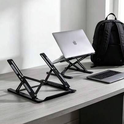 Support de cahier à un seul pied, avec un dos évidé pour une meilleure dissipation de la chaleur, hauteur réglable sur plusieurs niveaux, convient à divers appareils électroniques et fournitures de bureau. Idéal pour les travailleurs de bureau, un support ultra-pratique pour écran plat pliable et dépliable, avec un sac de rangement.