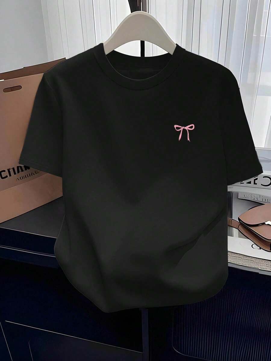 Camiseta de mujer casual, moderna y versátil para el hogar, cuello redondo, ropa casual de moda, camiseta con estampado de lindo lazo rosa, camiseta cómoda, versátil y fácil de usar con cuello redondo, adecuada para usar en primavera y verano, adecuada para cualquier ocasión - Negro - Ver 1