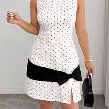 YijiaNvz  Vestido mini de punto de línea A con contraste de lunares y lazo, elegante y sin mangas, para mujer de talla grande, primavera/verano - Albaricoque - Ver 1