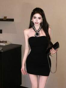 An Elegant And Sophisticated Halter-Neck Women's Dress With An Open Back. Perfect For Summer. The Slim Silhouette Offers Excellent Figure-Flattering Effects. An Ideal Dress For Summer. - Black - View 1