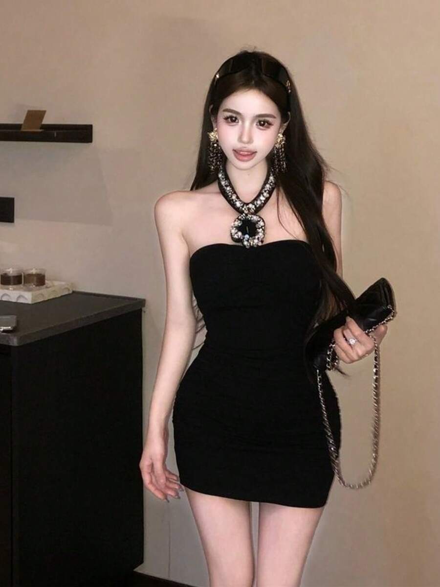 An Elegant And Sophisticated Halter-Neck Women's Dress With An Open Back. Perfect For Summer. The Slim Silhouette Offers Excellent Figure-Flattering Effects. An Ideal Dress For Summer. - Black - View 1