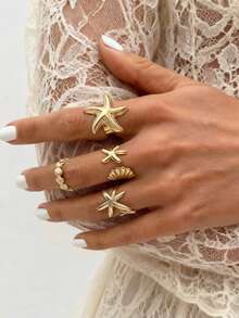 Set de 4 anillos apilables con estrella de mar y concha de estilo playero dorados, ajustables para adolescentes, joyería de verano con temática oceánica - Dorado - Ver 4