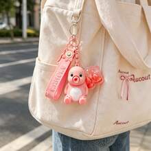 MINISO NaiLong 粉色坐姿公仔鑰匙圈，可愛卡通角色吊飾，附粉色矽膠繩與透明爪爪吊飾，包包掛飾、背包吊飾、錢包配件，返校禮物 - 款式1 - 查看 2