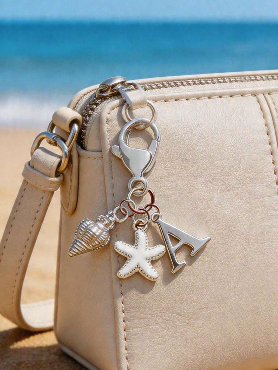 Chaveiro Boho Prateado com Inicial, Concha e Estrela-do-Mar, Chaveiro Personalizado com Letras de A a Z, Pingente para Bolsa com Estética de Férias na Praia, Joia Costeira para Bolsa, Mochila, Carteira e Chaves do Carro. Acessório Boho de Verão para Mulheres, Meninas e Amantes da Praia. Perfeito para Viagens, Férias, Uso Diário e Looks de Resort, Presente Ideal para o Verão de 2026, Aniversário, Formatura, Dia dos Namorados e Presentes de Amizade. - Multicolorido - Ver 1