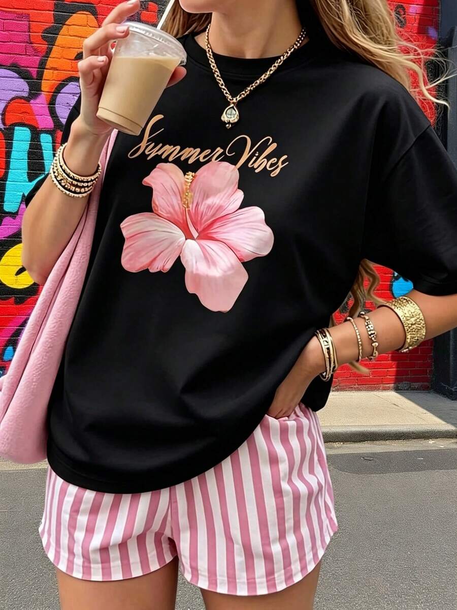 A New Product Has Been Launched: A Comfortable And Practical Women's T-Shirt With A Round Neck And Short Sleeves, Featuring A Pink Floral Print Design, Available At An Affordable Price For Spring And Summer. - Black - View 1