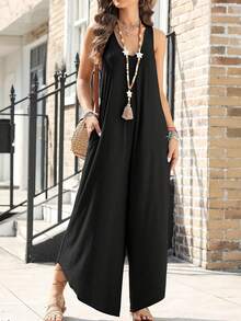 Jumpsuit With Back Straps And Irregular Trousers - Black - View 3