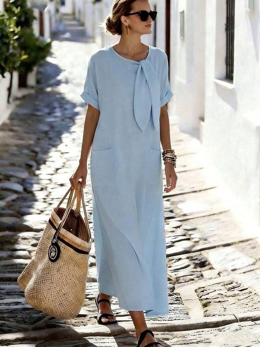 Holidaya Vestido de mujer de manga corta de longitud media con cuello de corbata, bolsillo suelto y textura de tela de color albaricoque para uso diario, viajes y vacaciones. Vestido largo de mujer estilo resort, vestido casual de verano Zanzea para mujer. Vestidos casuales largos para mujer en color azul claro, azul bebé y turquesa. - Celeste - Ver 1