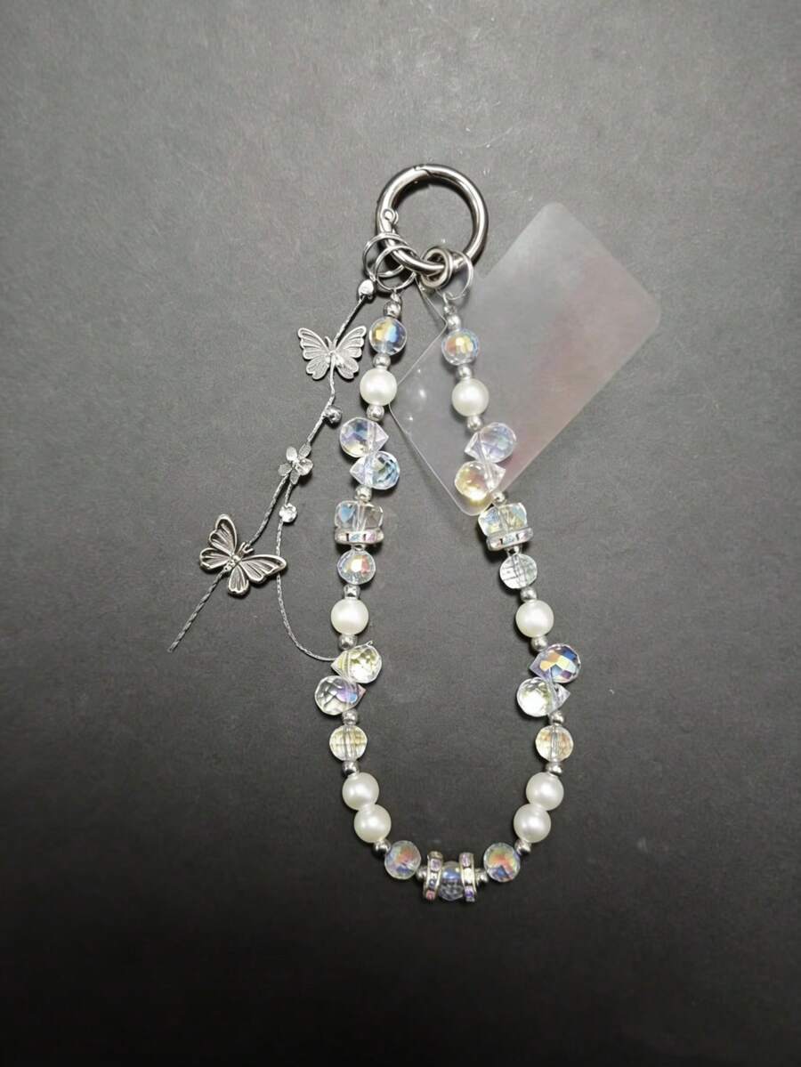 1 pieza Cordón para teléfono con mariposa, muñequera con cuentas de cristal iridiscente y perla, accesorio versátil anti-pérdida (Debido al ángulo de disparo y la magnificación, el tamaño real puede diferir ligeramente de la foto)