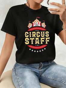 Art T-Shirt. The Print Showcases The Joyful Energy Of A Circus With Red And Gold Tents, Evoking Fun, Passion, And A Festive Spirit That Conveys Vitality And Confidence. This Women's 100% Cotton T-Shirt Is Comfortable And Stylish For Everyday Wear. - 黑色 - 查看 1
