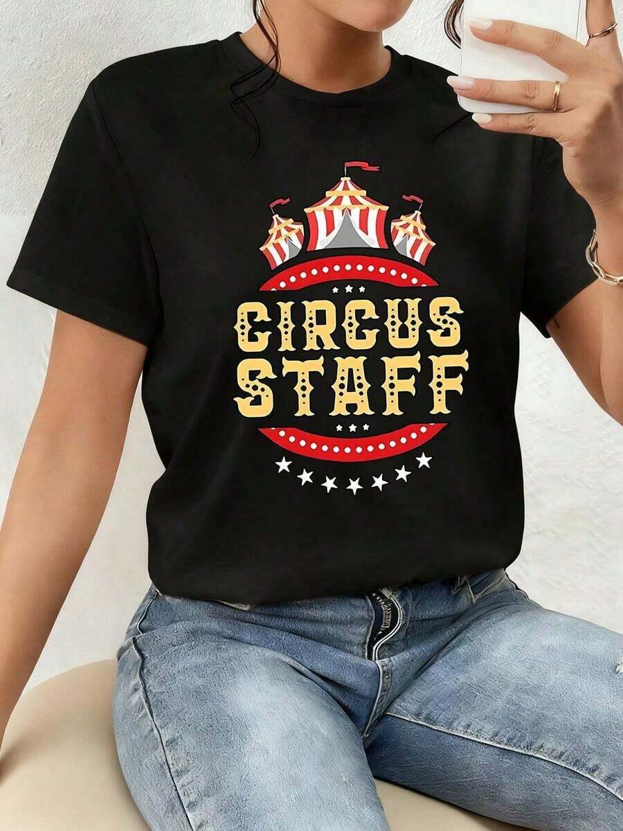 Art T-Shirt. The Print Showcases The Joyful Energy Of A Circus With Red And Gold Tents, Evoking Fun, Passion, And A Festive Spirit That Conveys Vitality And Confidence. This Women's 100% Cotton T-Shirt Is Comfortable And Stylish For Everyday Wear. - 黑色 - 查看 1