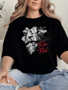 Stacks Of Banknotes Form A Figure Symbolizing Ambition, Effort, And The Desire For Prosperity, Set Against A Bold Red Background That Inspires Confidence And Energy. A Comfortable, Modern, Casual Women's T-Shirt For Everyday Wear. - 黑色 - 查看 1