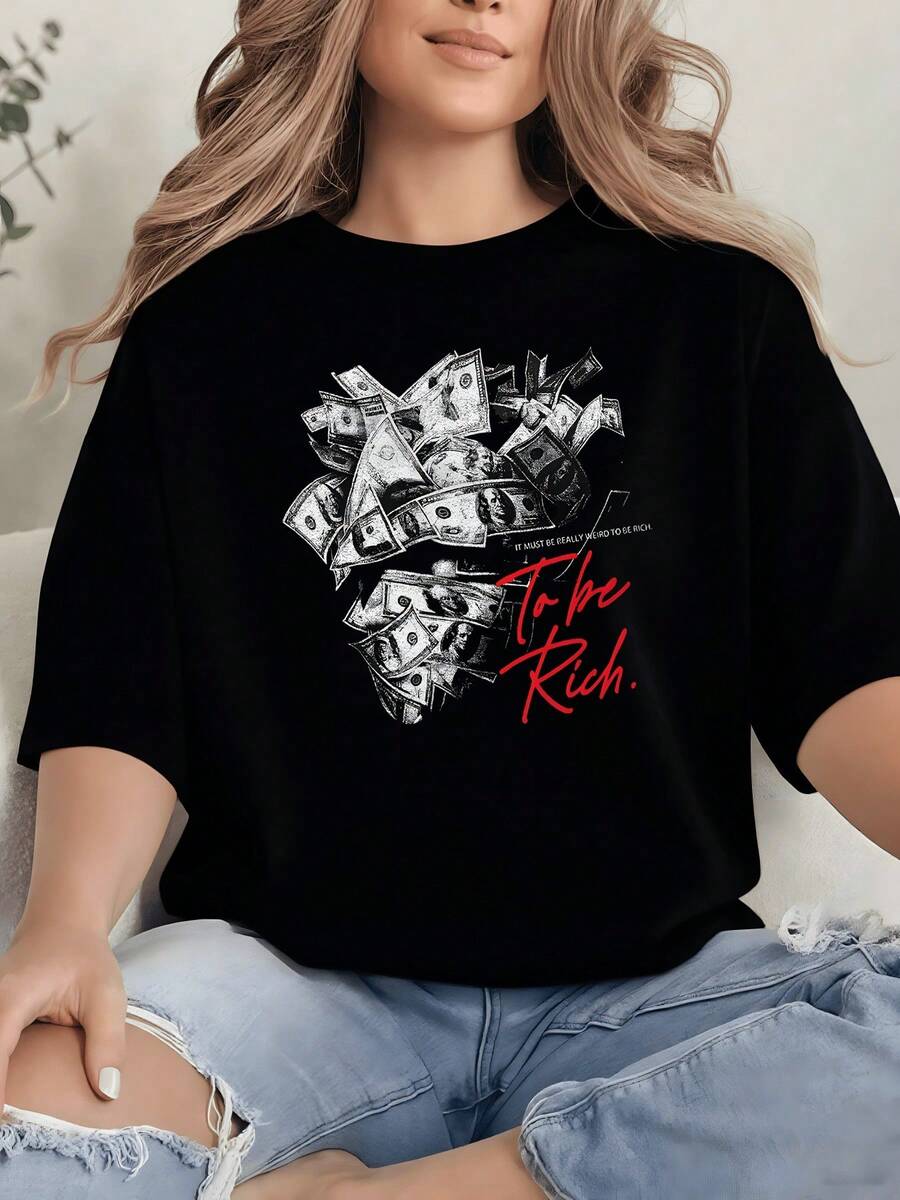 Stacks Of Banknotes Form A Figure Symbolizing Ambition, Effort, And The Desire For Prosperity, Set Against A Bold Red Background That Inspires Confidence And Energy. A Comfortable, Modern, Casual Women's T-Shirt For Everyday Wear. - 黑色 - 查看 1