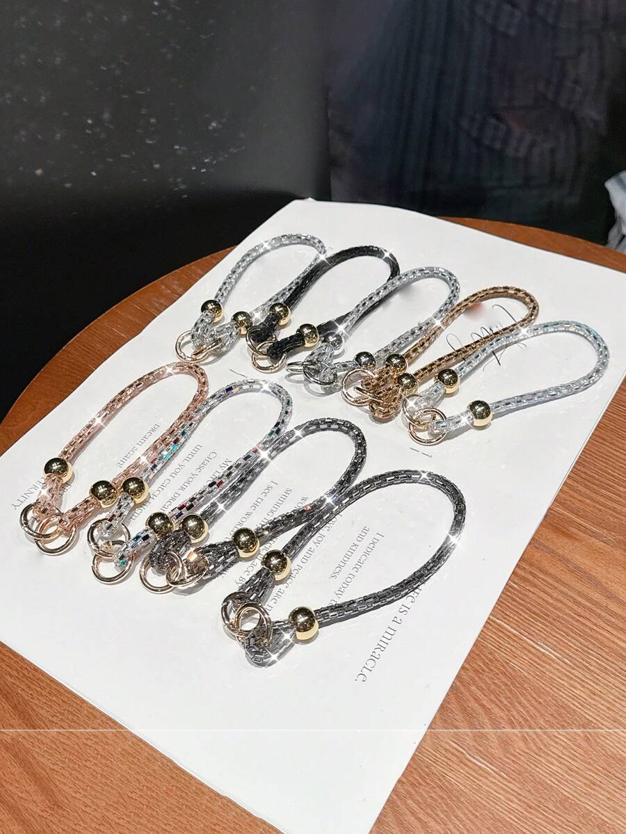 1条奢华水钻短款手机挂绳，饰以金色珠子和玻璃水晶，适用于手机挂绳、腕链，可搭配包包使用