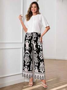 Conjunto informal de 2 piezas de mujer para vacaciones, con blusa de manga corta tipo murciélago de unicolor y pantalones de pierna ancha con estampado floral, para primavera/verano/otoño - Multicolor - Ver 7