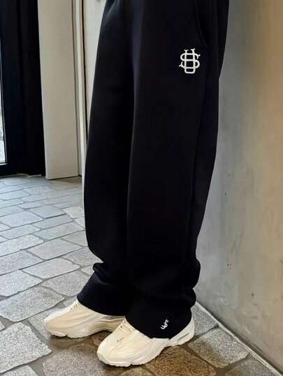 Pantalones casuales y de calle para hombres con estampado único, dobladillo dividido y ajuste holgado, pantalones deportivos estampados aptos para todas las estaciones