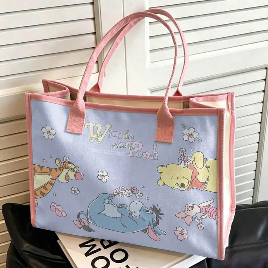 Miniso 迪士尼小熊维尼和朋友们手提袋,浅蓝色背景搭配粉色滚边,印有可爱图案,大容量多用途手提袋,适合购物、通勤、上学和旅行。 - 粉色 - 查看 1