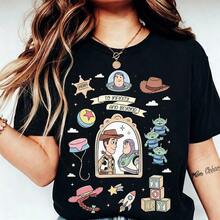 (Authorized By Disney. Mickey Mouse) The Front Features The Famous Retro-Style Scene Of Woody And Buzz Lightyear Looking At Each Other, Complete With Cowboy Hat, Space Helmet, Alien, Spring-Loaded Dog Collar, Jessie's Hat, The Pisa Planet Logo, The Letter "TOY" Made Of Building Blocks, And Other Iconic Elements. The Classic Phrase "TO INFINITY AND BEYOND" Is Prominently Displayed In The Center. There's Also A Selection Of Stylish Women's T-Shirts Made From Pure Cotton. The Fabric Is Soft, Comfortable, And Breathable, Making It Perfect For Everyday Wear, Shopping, Travel, Parties, And Lounging At Home. Suitable For Both Women And Men, These Garments Also Make Excellent Gifts. Every Woman Should Own One. - màu đen - Xem 1
