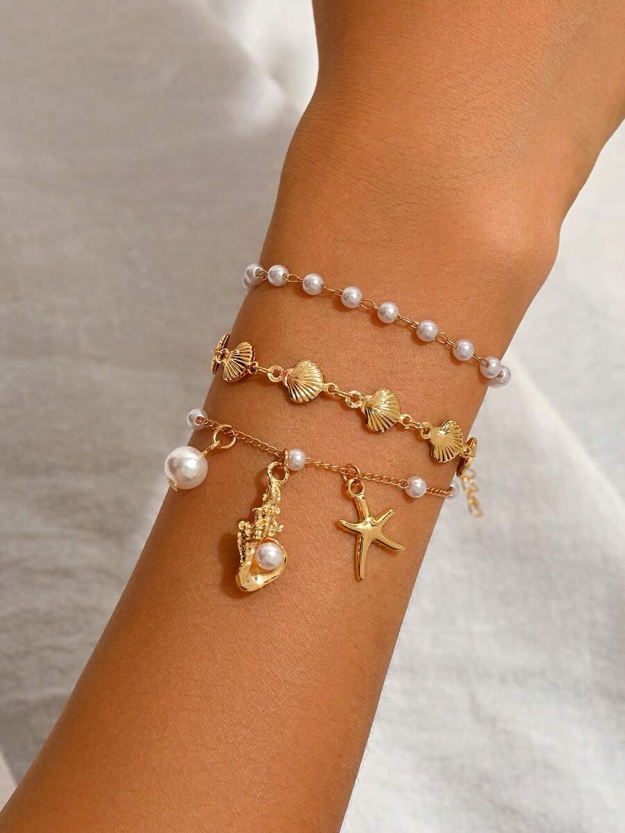 Set de 3 piezas de joyería con estilo de vacaciones románticas con tema oceánico, que incluye collar con colgante de estrella de mar y concha, pulsera combinación de oro de moda adecuada para uso diario y fiestas en la playa. Longitud de la cadena hecha a mano y cantidad de perlas y conchas aleatorias. - Dorado - Ver 1