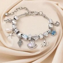 1 pieza Pulsera con cuentas de estilo playa y océano con colgantes de estrella de mar, concha, caracol y tortuga, accesorio versátil con vibra de vacaciones de verano y cadena de serpiente - Pulsera de vida marina - Ver 1