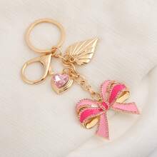 Llavero con colgante de corazón con strass en forma de lazo rosa, accesorio brillante y femenino ideal como regalo para fiestas y cumpleaños - Multicolor - Ver 5