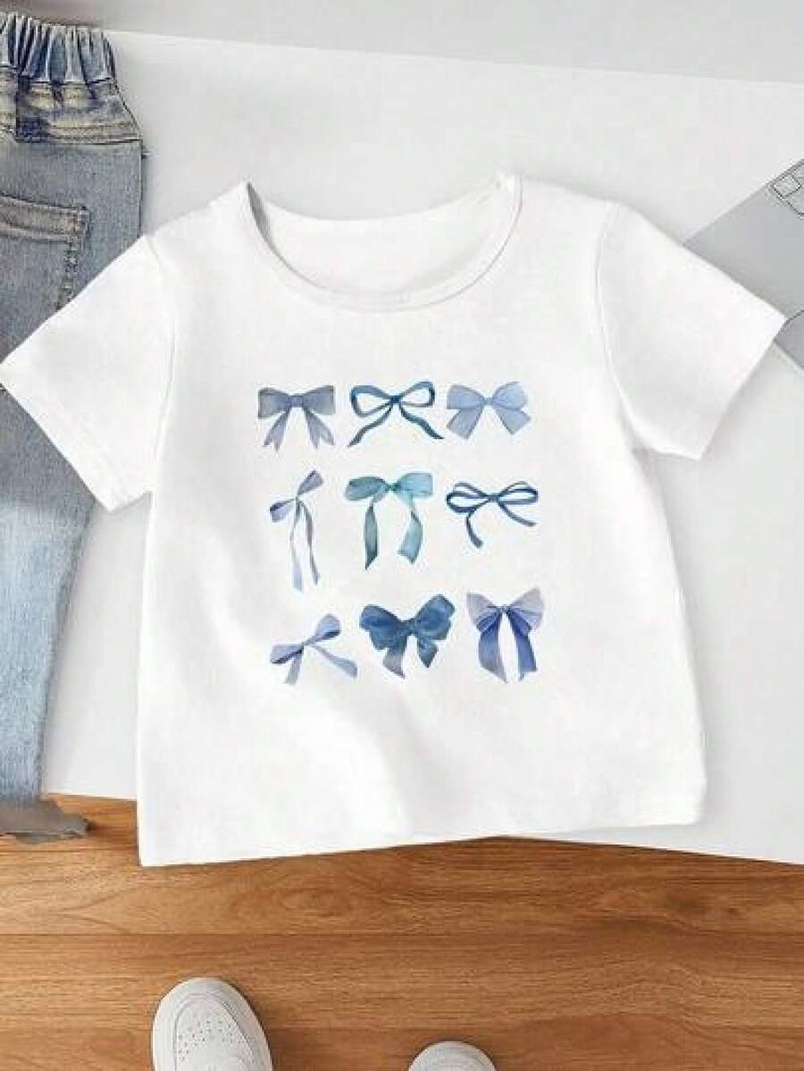 Solo hay una camiseta de manga corta a la .Camiseta de manga corta para niña adolescente , con lazo azul y estampado creativo y estético, adecuada para salidas y para crear un look lindo de adolescente, vestido juvenil de verano para adolescentes. - Negro - Ver 1