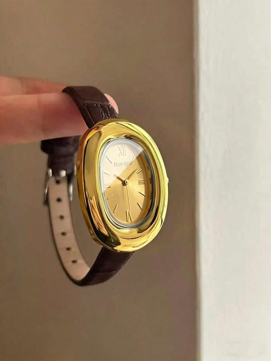 1件女士复古极简石英表,复古椭圆形小表盘,金色合金椭圆形表壳搭配深棕色鳄鱼皮表带,优雅的金色调散发经典魅力,金色表盘饰以罗马数字和金色指针。 - 棕色 - 查看 1