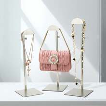 An Elegant, Height-Adjustable Handbag Display Rack Made Of Stainless Steel; Features A Handbag Holder, Hat And Jewelry Rack, And Single-Pouch Jewelry Display; Ideal For Closets And Boutiques; Easy To Install And Disassemble; - / - View 5