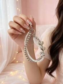 1 chiếc ốp điện thoại hình trái tim hai lớp mạ ngọc trai kèm dây đeo cổ tay, dây đeo chống thất lạc đính hạt bạc, phụ kiện ốp điện thoại và tai nghe đa năng. - Bạc - Xem 5