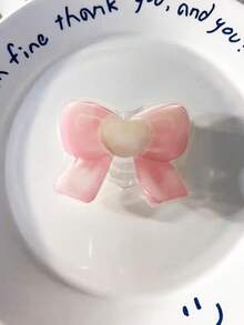 1件甜美青少年風格粉色蝴蝶結造型氣墊手機支架，可伸縮可折疊桌面支撐架。採用透明壓克力材質，溫柔且充滿青春氣息。在看電視或瀏覽影片時解放雙手，穩定且實用。牢固附著不損壞手機殼。輕巧便攜。 - 彩色 - 查看 4