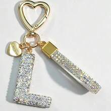 Móc khóa chữ cái A-Z đính đá lấp lánh, khóa hình trái tim vàng với mặt dây chuyền "LOVE YOU" và dây đeo đính đá lấp lánh, phụ kiện trang trí túi xách thanh lịch, món quà tốt nghiệp và sinh nhật hoàn hảo. - trắng - Xem 20