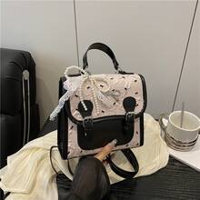 Bolso de mano moderno y versátil para mujer, estilo casual elegante con un toque de alta gama, bolso de hombro estiloso ideal para ir de compras, mochila pequeña con estampado de lazo estilo universitario para mujer, nueva mochila de viaje casual y elegante, versión coreana de moda para el verano de 2026. - Rosa sin colgante - Ver 1