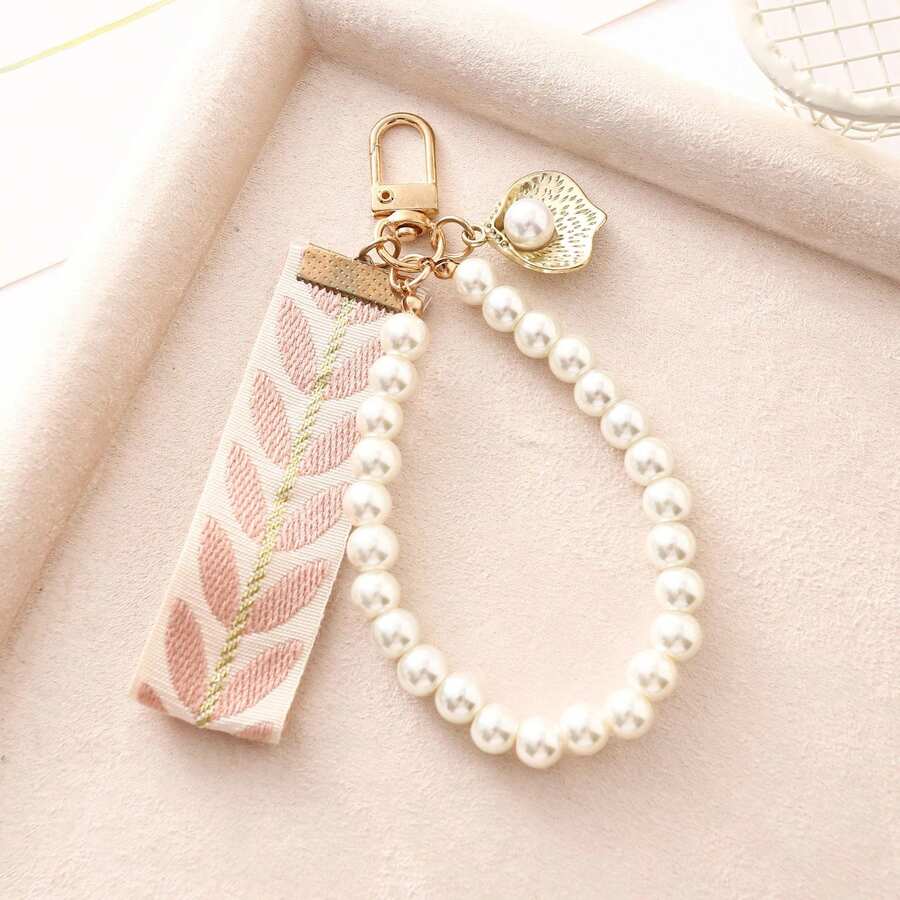 1 Móc khóa ngọc trai thanh lịch, dây đeo cổ tay thêu lá bằng vải, chất liệu hợp kim và ngọc trai giả, phụ kiện trang trí túi xách đa năng, món quà tốt nghiệp và quà tặng hàng ngày hoàn hảo. - Màu Hồng baby - Xem 1