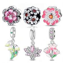 Một chiếc charm mạ bạc chủ đề hoa với thiết kế độc đáo kết hợp các yếu tố của hoa đào, hoa ly và hoa tulip. Mặt dây chuyền tráng men này được điểm xuyết bằng kim cương và có thể kết hợp với vòng tay hoặc dây chuyền. Là một phụ kiện làm trang sức tươi mới và thanh lịch, nó toát lên vẻ quyến rũ mềm mại và nữ tính, hoàn hảo cho cả các dự án DIY và đeo hàng ngày. - Nhiều màu - Xem 1