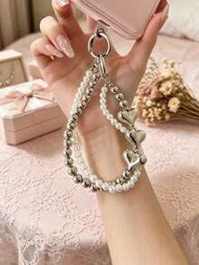 1 chiếc ốp điện thoại hình trái tim hai lớp mạ ngọc trai kèm dây đeo cổ tay, dây đeo chống thất lạc đính hạt bạc, phụ kiện ốp điện thoại và tai nghe đa năng. - Bạc - Xem 3