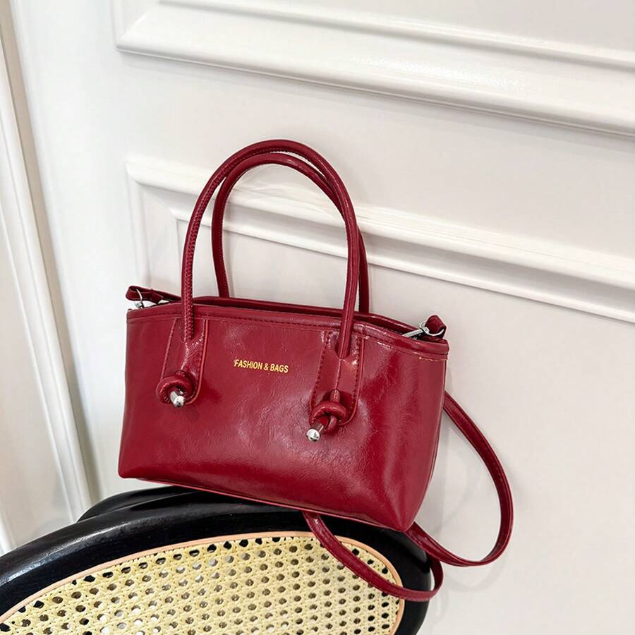Bolso de mano moderno y versátil para mujer, estilo casual elegante con un toque de alta gama, bolso de hombro estiloso ideal para ir de compras, nuevo bolso tote pequeño y elegante para mujer 2026, nuevo bolso francés de nicho para ir al trabajo, bolso de hombro y bandolera de gran capacidad. - Negro - Ver 1