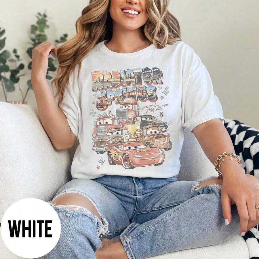 Disney Women's T-Shirt 1PC Licensed "Vintage Radiator Springs Lightning McQueen & Cars Crew Group Portrait" Cartoon Printed Oversized T‑Shirt, Short Sleeve Tee For Disney Travel, Vacations & Theme Parks. 2026 New Style, Ideal For Family Outings & Matching Outfits, Unisex For All Ages. High‑Quality Cotton Fabric, Soft & Breathable. Retro Desert‑Themed Typography And Race‑Car Scene Print Design, Perfect Gift For Cars Movie Fans And Disney Family Vacation Trips. - White - View 1