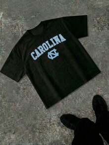 Blaues T-Shirt mit dem Schriftzug "CAROLINA" auf der Brust.Dieses T-Shirt mit Rundhalsausschnitt bietet einen klassisch-sportlichen Look. Reguläre Passform, Sommer-T-Shirt. - Schwarz - Übersicht 3