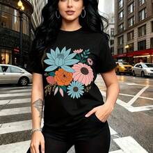Camiseta de mujer con estampado floral colorido en azul, rosa y naranja sobre fondo negro - camiseta casual de manga corta con ajuste cómodo y estilo urbano vibrante - ideal para paseos por la ciudad, salidas con amigas y regalo perfecto para mamá, e - Negro - Ver 11