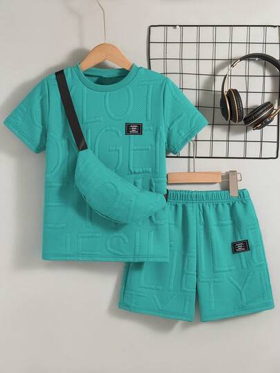 Set de 2 piezas de camiseta de cuello redondo de manga corta y pantalones cortos de unicolor casuales y de verano para niños pequeños con bolsillo