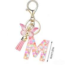 Llavero con letra, borla y colgante de mariposa, para billetera, mochila, bolso de mano - Multicolor - Ver 12
