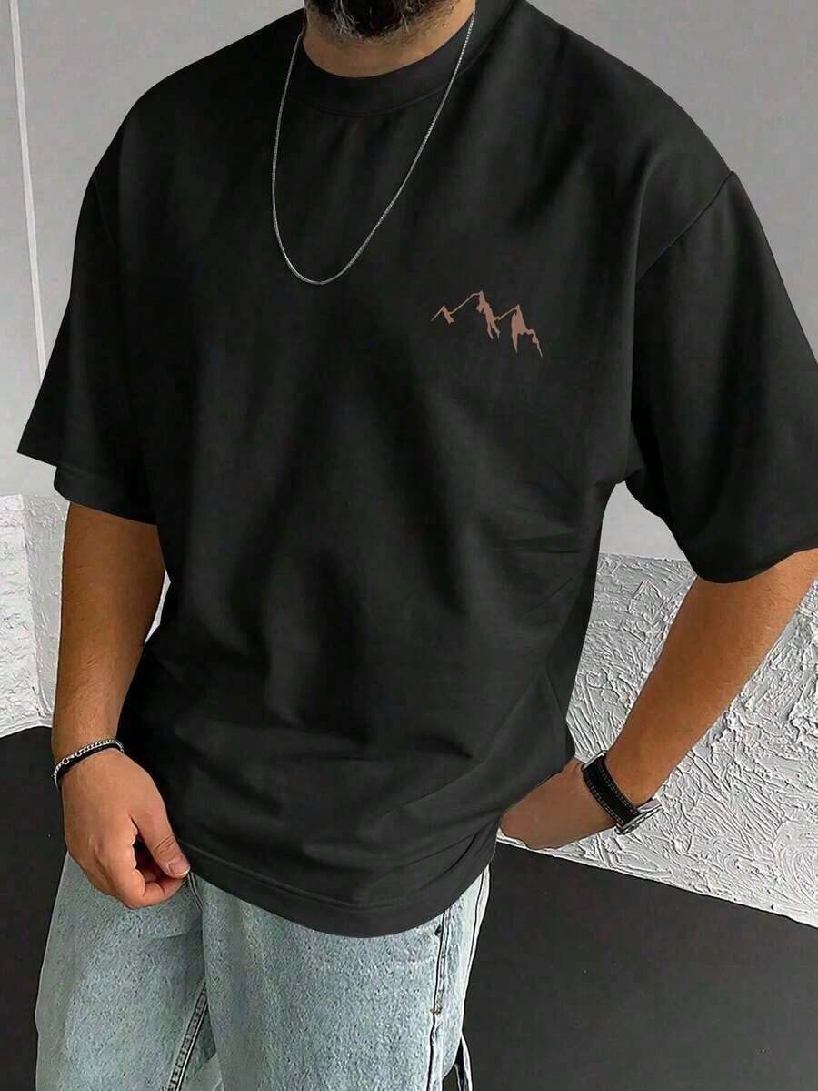 Camiseta minimalista blanca de manga corta con cuello redondo y estampado de silueta de montaña, artículo popular de verano.