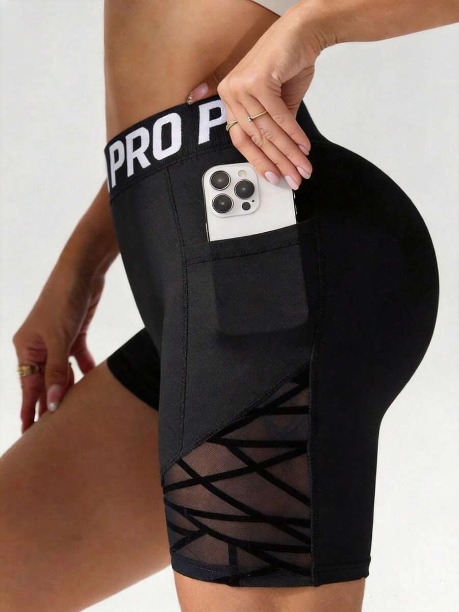 1 pieza Pantalones cortos de fitness de cintura alta con patchwork de malla para mujer, cintura con letra PRO, bolsillos dobles, secado rápido para entrenamiento, yoga, correr, ciclismo y deportes - Negro - Ver 1